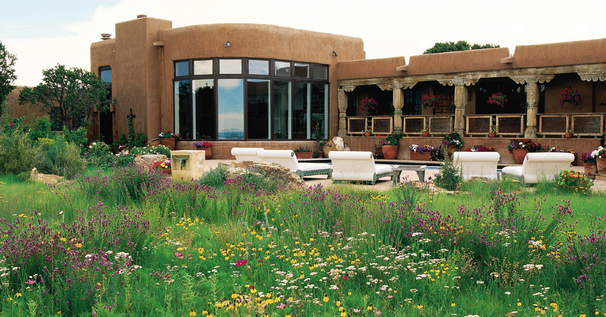 santa fe home with wildflower landscaping